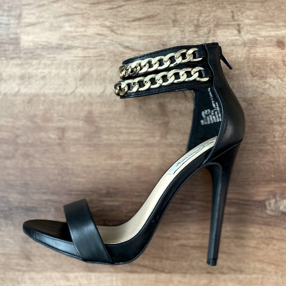 Black, gold chain ankle strap stiletto, size 6.